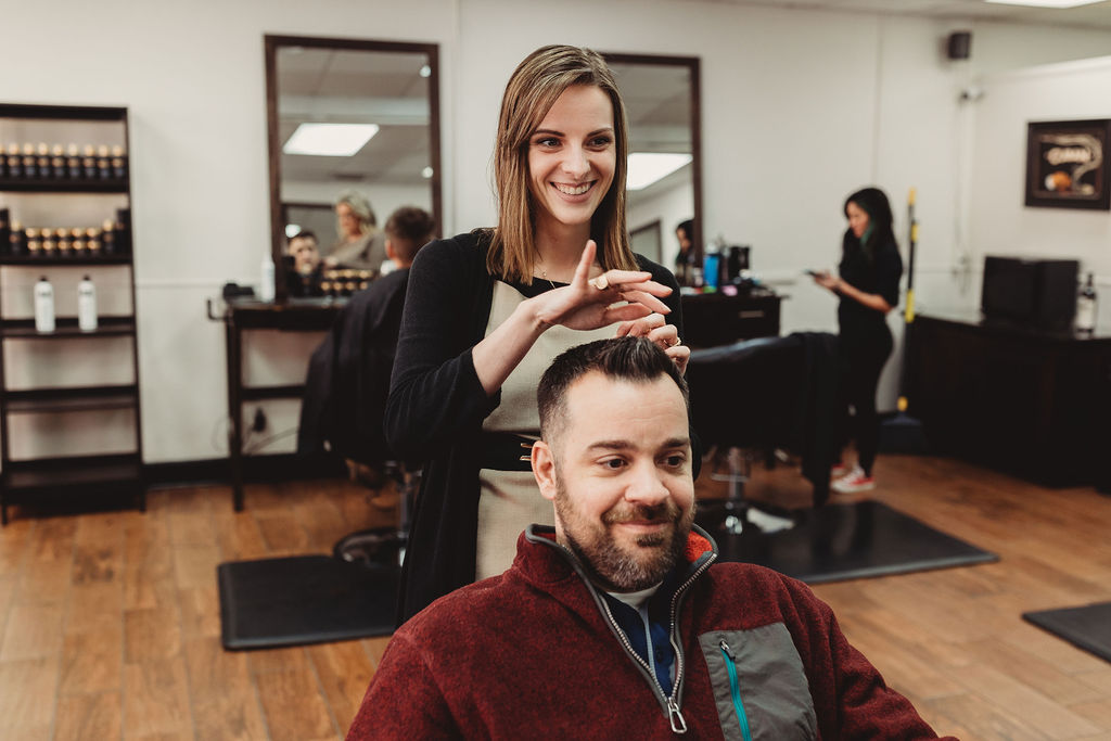Smiling client after a men's haircut at The Gentleman's Salon in State College, PA